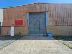 Exterior photo of 11 Anson Close. Image shows large shutters and a tiled exterior.