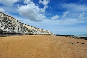 Sandy bay with the white cliffs