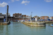 The Ramsgate Royal Harbour featuring a blue sea with buildings in the distance