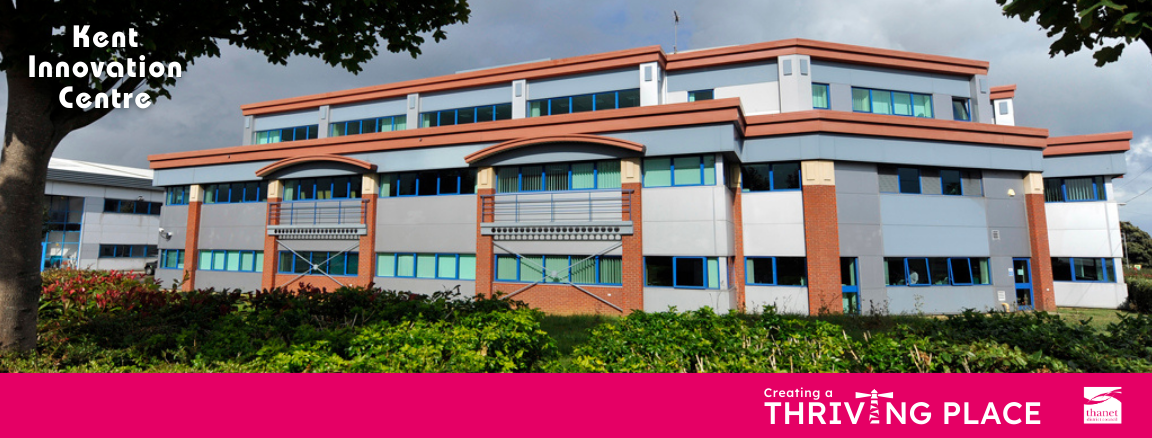A wide view of the Kent Innovation Centre building featuring grey cladding, red brick accents, and blue window frames, framed by tree branches on the left. A bright pink banner runs across the bottom containing the text 'Creating a THRIVING PLACE,' where a stylized white lighthouse replaces the letter 'I,' alongside the Thanet District Council logo on the right.