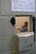 Looking through the jail door hole into the cell