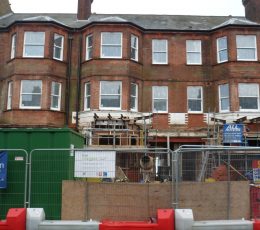 Refurbishment beginning with houses fenced off and scaffolding