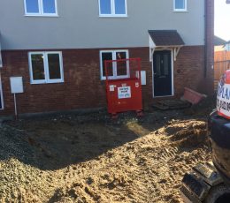 Houses nearing completing construction of front walkway