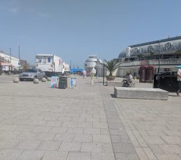 Paved area with some outdoor seating near local cafes, bars and restaurants