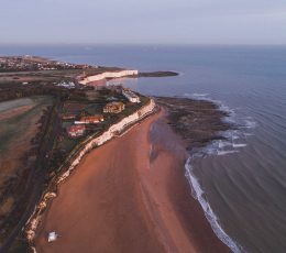 Overhead view of Joss Bay showing the cliffs, beach and sea