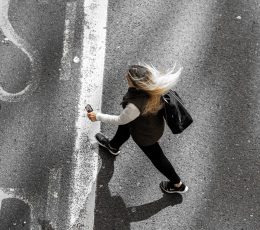 Above shot of woman crossing road