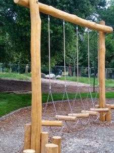 Wooden swing bridge in children's play area