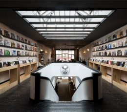 Inside Cliff's shop are rows of shelves with vinyls with stairs leading to a lower level.