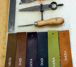 Tools at the top of the image and a row of colourful embossed bookmarks beneath