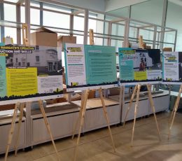 Bright image of three exhibition boards on wooden easels