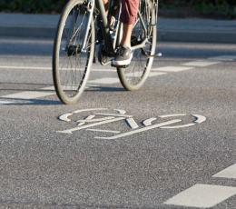 Cycle path on road with two sets of bicycle wheels visible