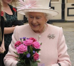 Queen Elizabeth II holding a bouquet of flowers