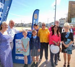 Volunteers with the new recycling stations along beach promenade
