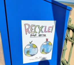 Newington Community Primary School 'Recycle! Don't litter' poster on the side of the new recycling bin