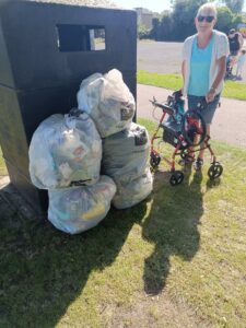 Ramsgate Litter Pickers - Mandy, a litter picker, with a stack of full litter bags.