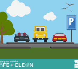 Cartoon image of three cars (grey, yellow and red) parked in a car park, there is a blue parking sign and a tree. There is some grass and a blue sky with clouds. There is a blue banner across the bottom with the caption ‘keeping our district safe and clean’ with the Thanet District Council logo on the right hand side.