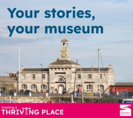 A landscape photo of the Clock House Museum at Ramsgate Harbour under a bright, clear sky. The historic two-storey stone building features a central clock tower with a white belfry. Large blue text at the top reads, "Your stories, your museum." The foreground shows the harbour edge with boat masts and a red container. A vibrant pink banner across the bottom includes the Thanet District Council logo and the slogan "Creating a THRIVING PLACE" with a lighthouse icon.