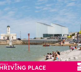 A sunny day at Margate harbour with people sitting on steps, Turner Contemporary in the background, and a sailboat.