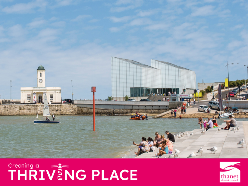 A sunny day at Margate harbour with people sitting on steps, Turner Contemporary in the background, and a sailboat.