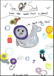 A child's drawing focusing on the danger of plastic rings to marine life. It shows several grey seals with colorful plastic rings or frisbees stuck tightly around their necks. Speech bubbles from the seals say 'we dont like this!', 'It hurts', and 'oww!'. Floating rubbish surrounds them, and text reads 'Save Our Seals', 'Save the seals from frisbees!', and '#Pegwell seals'.