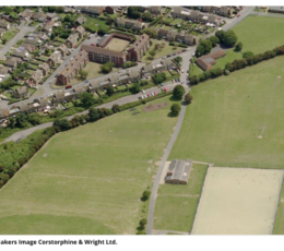 An aerial photograph of the Jackey Bakers Recreation Ground in Ramsgate. The image shows playing fields, a path running through the middle, a small building, and an artificial sports pitch. Above the park lies a residential neighbourhood with houses, apartment blocks, roads, and parked cars. Across the bottom of the image, the text "Jackey Bakers Image Corstorphine & Wright Ltd." is printed in plain black font on a white background.