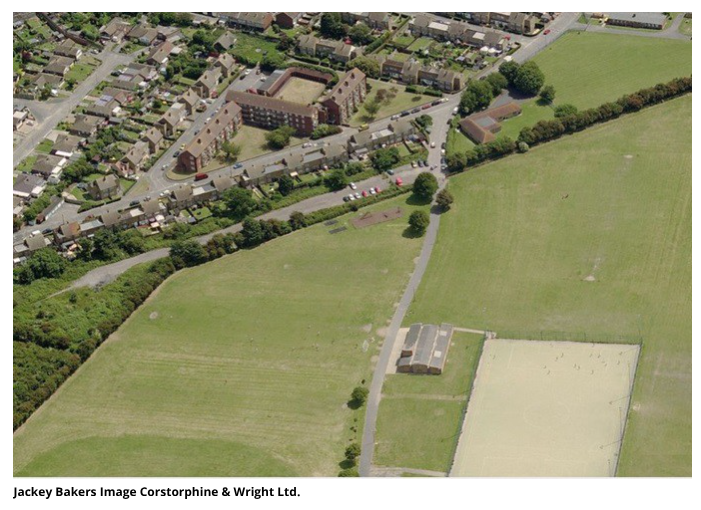 An aerial photograph of the Jackey Bakers Recreation Ground in Ramsgate. The image shows playing fields, a path running through the middle, a small building, and an artificial sports pitch. Above the park lies a residential neighbourhood with houses, apartment blocks, roads, and parked cars. Across the bottom of the image, the text "Jackey Bakers Image Corstorphine & Wright Ltd." is printed in plain black font on a white background.